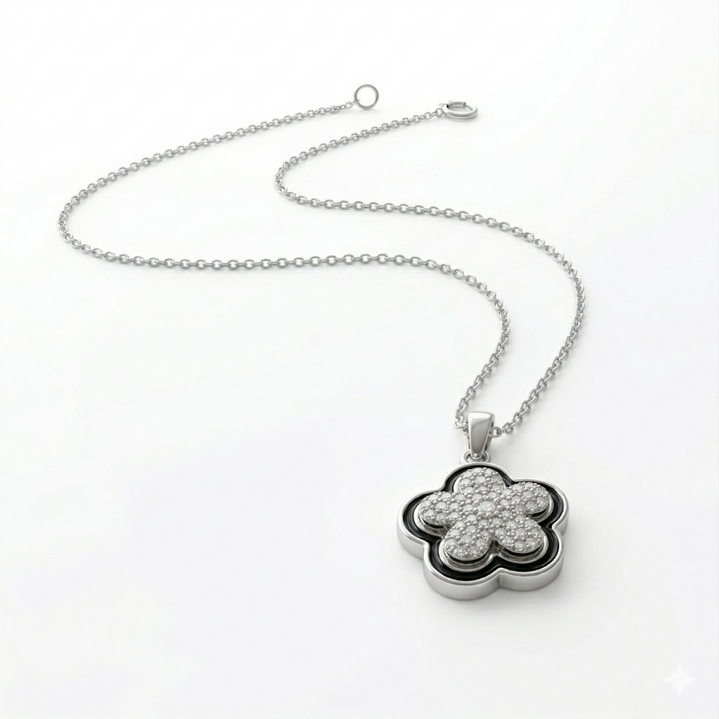Silver necklace with a clover-shaped pendant on a white background